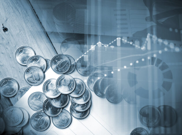 Image depicting income data, charts and a pile of coins