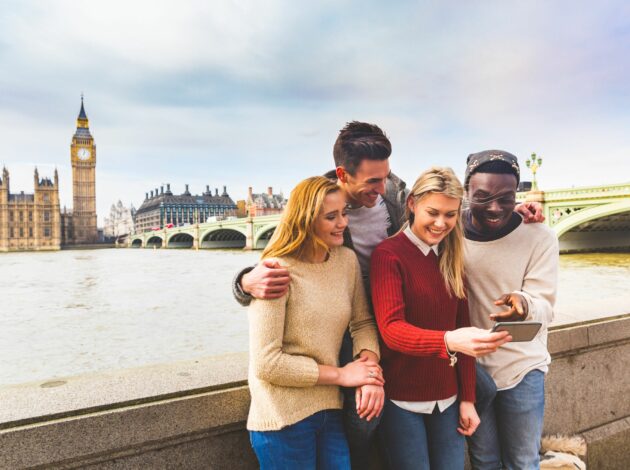 A group of people next to the River Thames