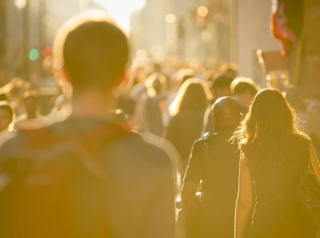 An image of people walking down a street