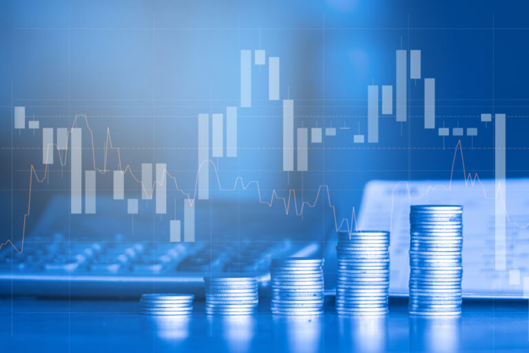 Image of graphs and money, indicating financial markets